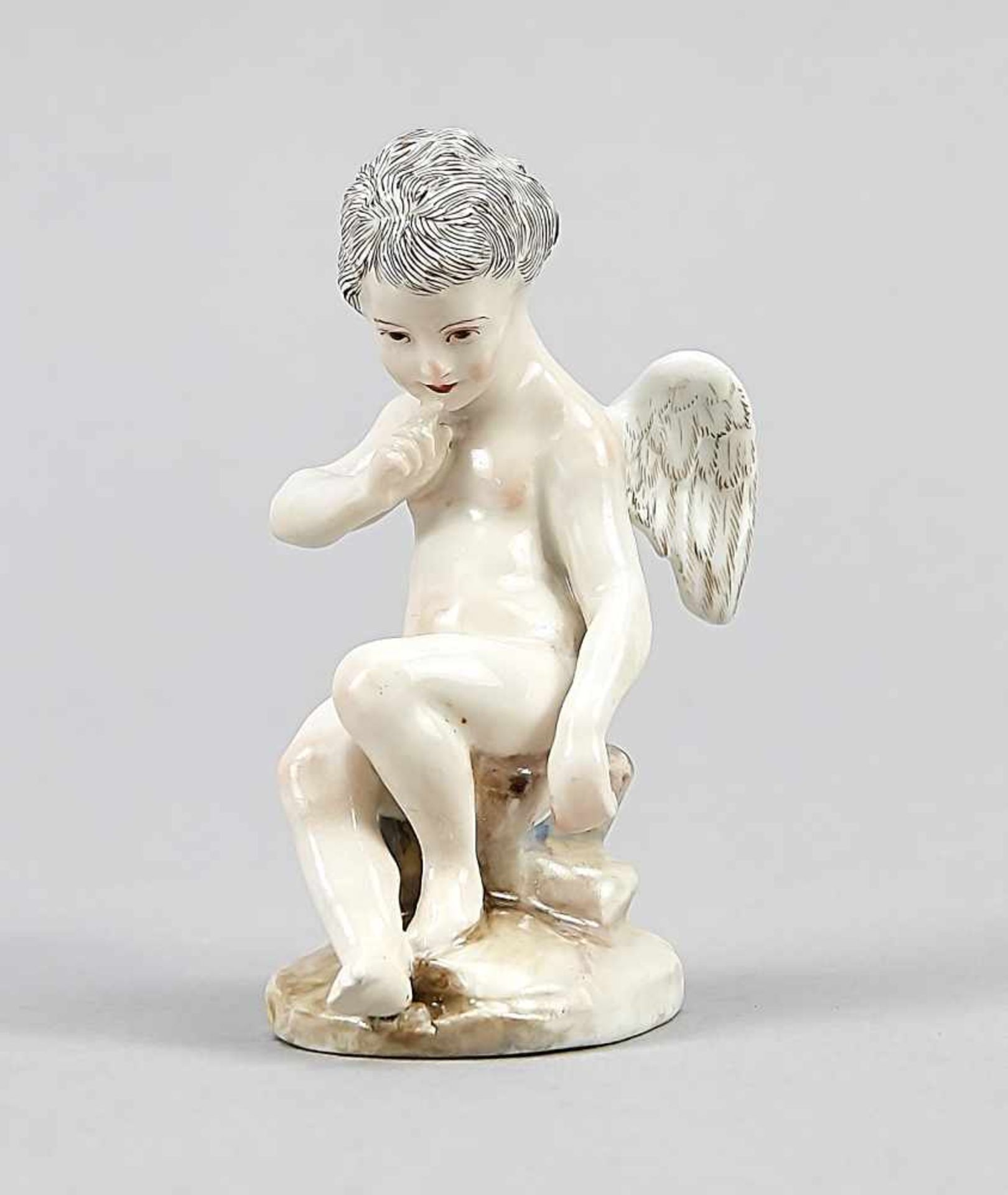 Seated putto, Meissen, brand 1850-1924, polychrome painted, model no. 311, fire crack in