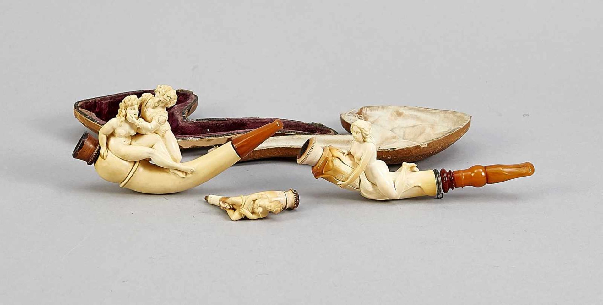 Two figural meerschaum pipes w. amber mouthpieces, pres. Austria, 19/20th c., l. 14.5 a.