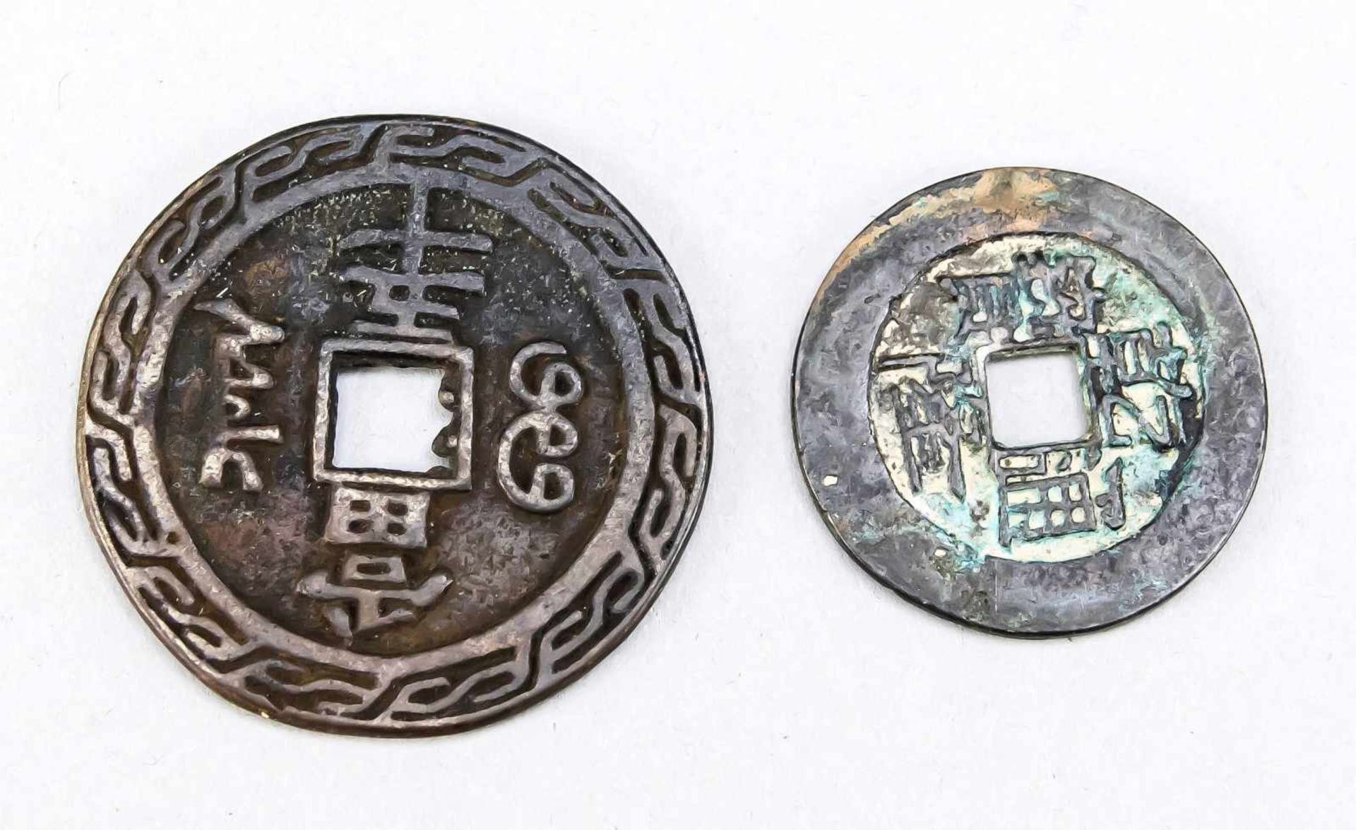 2 coin amulets, China, bronze. Round with square opening in the center, characters and