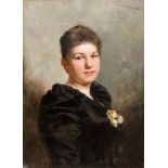 Wilhelm Kuhnert (1865-1926), Portrait einer jungen Frau in Schwarz mit Rosenschmuck, wohl