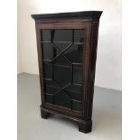 A MAHOGANY ASTRAGAL GLAZED CORNER CABINET