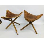 PAIR OF FOLDING TAN LEATHER STOOLS ON 3 FOOTED FOLDING BASE