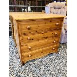 A HONEY PINE FOUR DRAWER CHEST