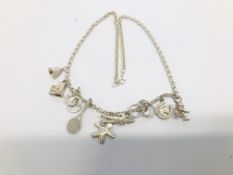 A SILVER NECKLACE WITH 9 CHARMS ATTACHED