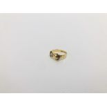 AN 18CT GOLD BUCKLE RING SET WITH SINGLE DIAMOND IN STARBURST SETTING