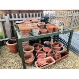 PAIR OF WOODEN FRAMED GARDEN POTTING TABLES + LARGE QUANTITY GARDEN POTS TO INCLUDE TERRACOTTA AND
