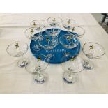 A SET OF 12 BABYCHAM GLASSES (ONE PLAIN) TOGETHER WITH AN ORIGINAL BABYCHAM TRAY