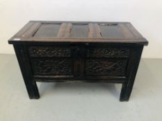 AN EARLY OAK BLANKET CHEST WITH HAND CARVED FLORAL DETAILING TO FRONT RAIL AND PANELS