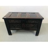 AN EARLY OAK BLANKET CHEST WITH HAND CARVED FLORAL DETAILING TO FRONT RAIL AND PANELS