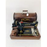 A VINTAGE SINGER MANUAL SEWING MACHINE COMPLETE WITH COVER
