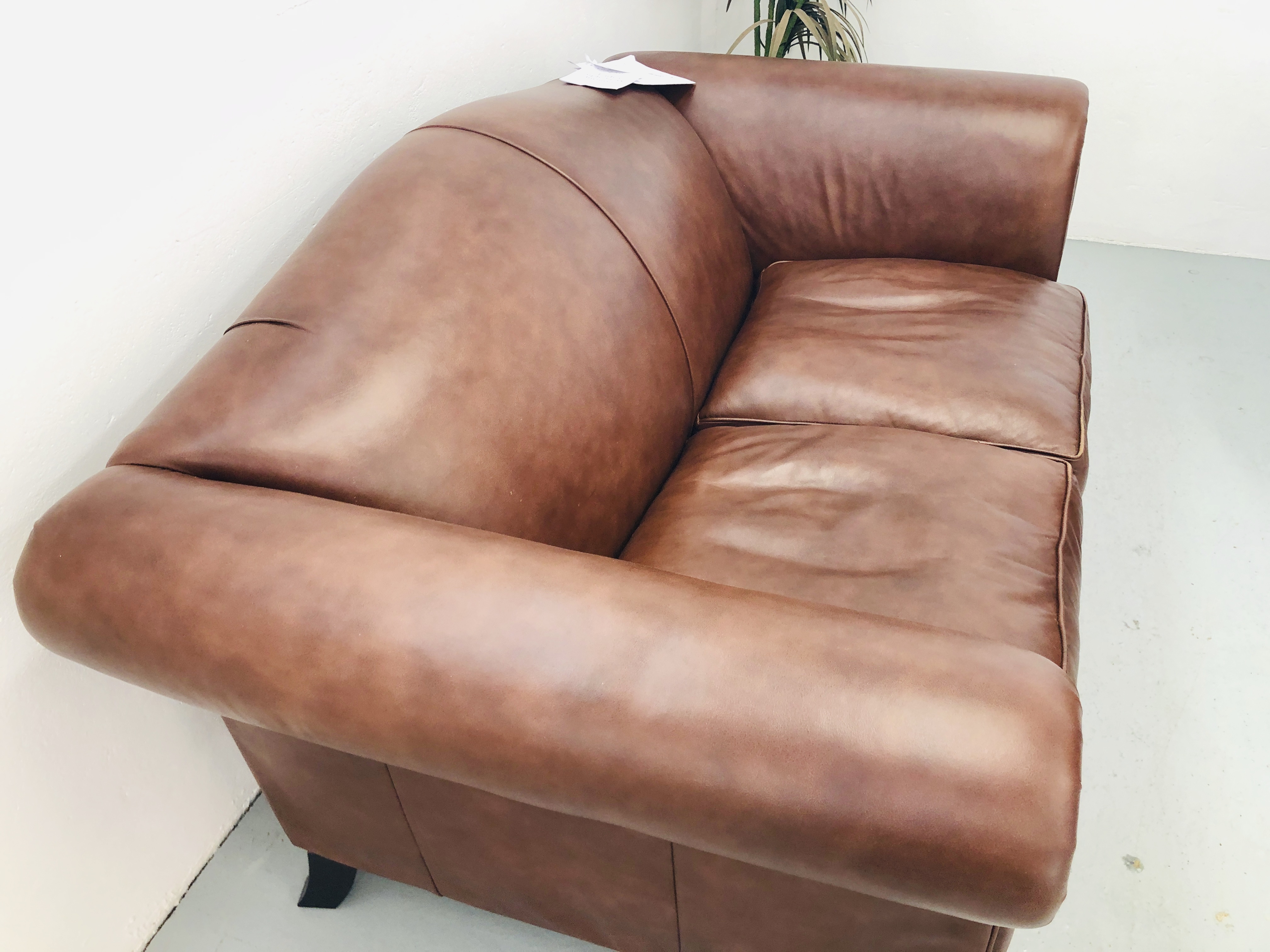 A LAURA ASHLEY TAN LEATHER TWO SEATER SOFA AND MATCHING LAURA ASHLEY TAN LEATHER WINGED RECLINER - Image 4 of 7