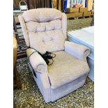 AN ELECTRIC RECLINING ARMCHAIR UPHOLSTERED IN A DUSKY PINK FABRIC - SOLD AS SEEN