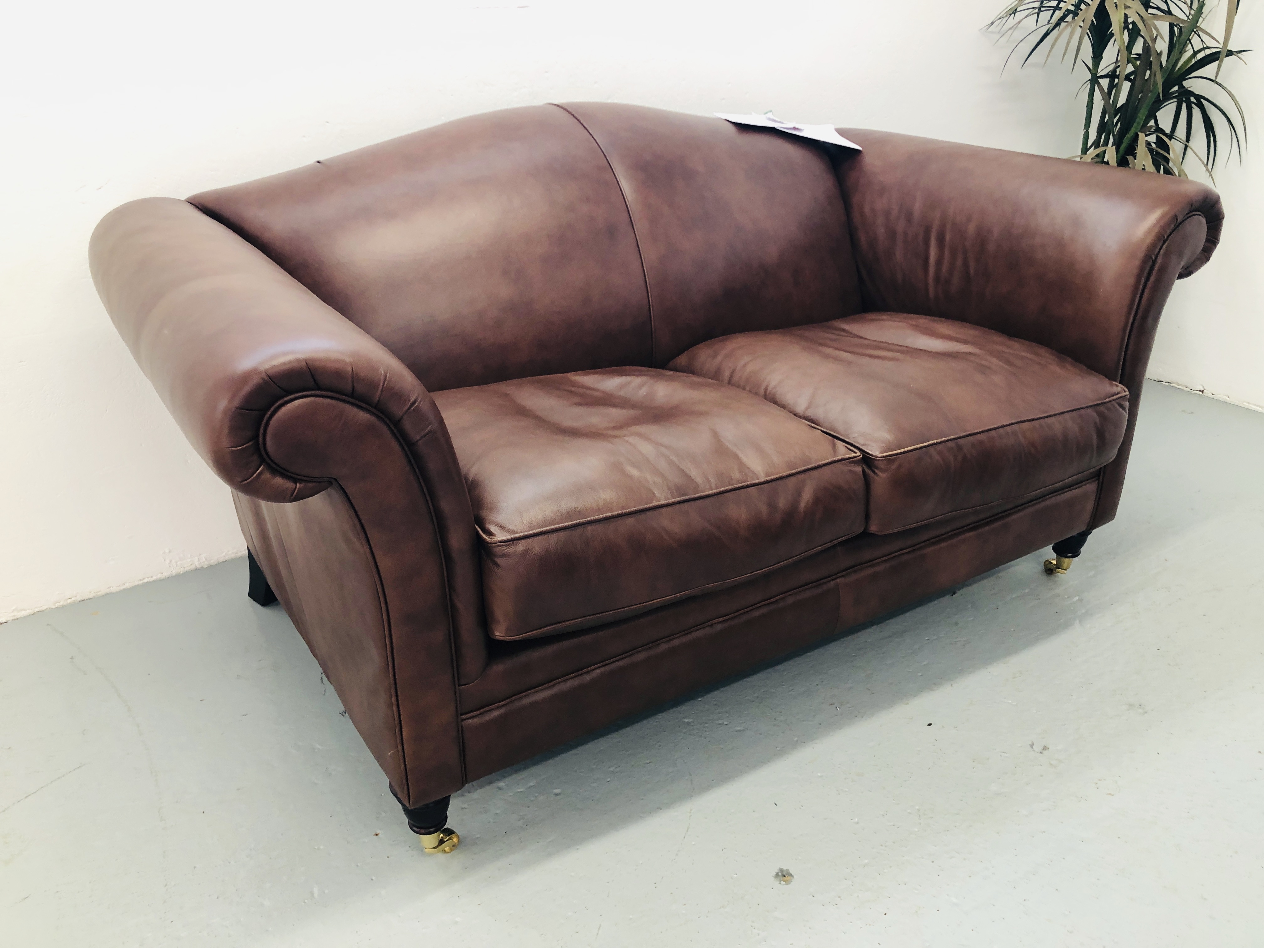 A LAURA ASHLEY TAN LEATHER TWO SEATER SOFA AND MATCHING LAURA ASHLEY TAN LEATHER WINGED RECLINER - Image 5 of 7