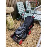 AN ICRA PETROL DRIVEN ROTARY MOWER WITH GRASS BOX AND INSTRUCTIONS - SOLD AS SEEN