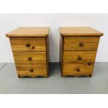 A PAIR OF HONEY PINE THREE DRAWER BEDSIDE CHESTS