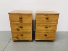 A PAIR OF PINE EFFECT FINISH THREE DRAWER BEDSIDE CHESTS