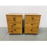 A PAIR OF PINE EFFECT FINISH THREE DRAWER BEDSIDE CHESTS