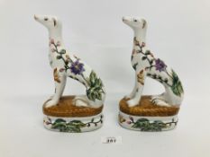 PAIR OF ORIENTAL FLORAL DECORATED DOGS BEARING CHINESE SYMBOLS TO BASE