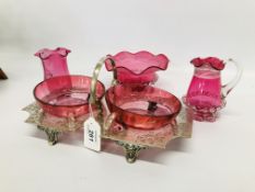 A SILVER PLATED ENTRÉ STAND WITH CRANBERRY GLASS INSERTS AND THREE FURTHER PIECES OF CRANBERRY