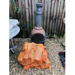 A CHIMINEA AND FOUR BAGS OF LOGS