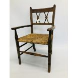 A VINTAGE CHILD'S ELBOW CHAIR WITH RUSH SEAT