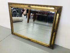 A GILT FRAMED RECTANGULAR MIRROR WITH BEVELLED PLATE GLASS 42 INCH WIDE 30-5 INCH HEIGHT