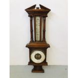 AN ORNATE CARVED OAK WALL BAROMETER