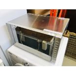 A TESCO STAINLESS STEEL COMBINATION MICROWAVE OVEN MODEL MC2514 - SOLD AS SEEN