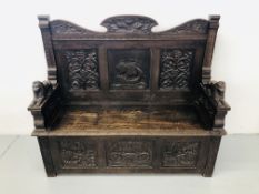 HEAVILY CARVED OAK SETTLE DEPICTING SHIPPING END VINE DETAILING TO PANELS