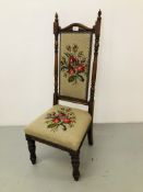 A ROSEWOOD NURSING CHAIR WITH FLORAL NEEDLE CRAFT UPHOLSTERED SEAT AND BACK