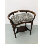 AN EDWARDIAN MAHOGANY KIDNEY SHAPED DRESSING STOOL WITH UPHOLSTERED CUSHION`