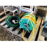 A HOZELOCK GARDEN HOSE ON REEL AND ONE OTHER HOSE