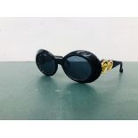 A PAIR OF DESIGNER SUNGLASSES MARKED GIANNI VERSACE MODEL 418/C