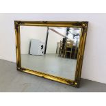 LARGE BEVEL PLATE WALL MIRROR WITH SCROLL DESIGN ON A GILT FINISH BACKGROUND