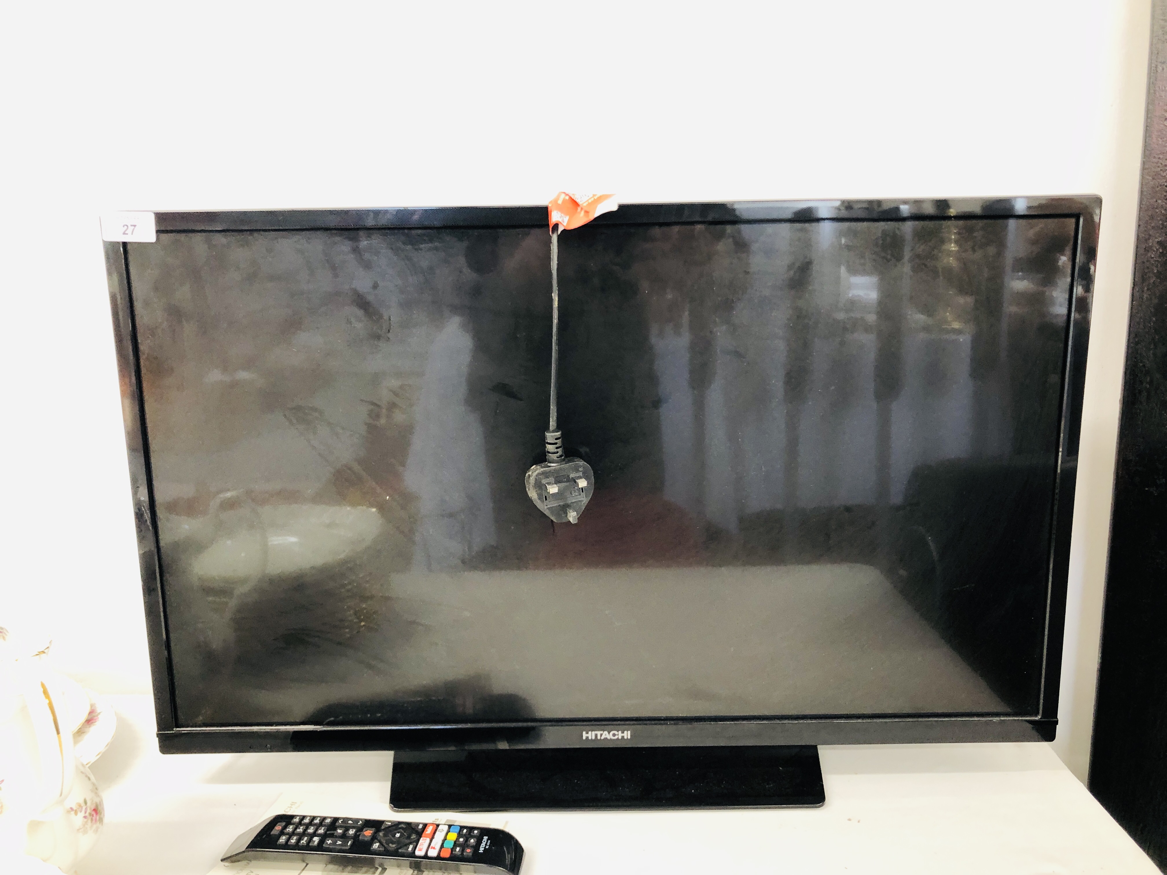 HITACHI 32" FLAT SCREEN TV WITH REMOTE - SOLD AS SEEN