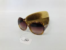 PAIR OF DESIGNER SUNGLASSES MARKED "MIU MIU" WITH CASE