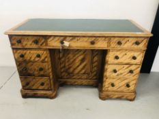 AN ANTIQUE 8 DRAWER KNEE HOLE DESK WITH GREEN LEATHERETTE TOP