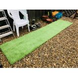 A STRIP OF ASTROTURF 128 INCH X 30 INCH