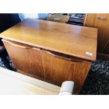 A G-PLAN STYLE TEAK FINISH TWO DOOR CABINET AND A RETRO STYLE TWO TIER TEAK FINISH COFFEE TABLE + A