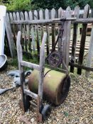 A VINTAGE JAMES SHOOLBRED HEAVY CAST IRON LAWN ROLLER AND BYGONE SACK BARROW
