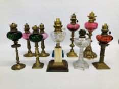 10 X VINTAGE OIL LAMPS WITH VARIOUS COLOURED GLASS FONTS ON MAINLY BRASS BASES