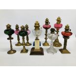 10 X VINTAGE OIL LAMPS WITH VARIOUS COLOURED GLASS FONTS ON MAINLY BRASS BASES