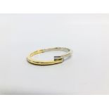 A YELLOW AND WHITE GOLD HINGED BANGLE MARKED 750