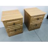 A PAIR OF MODERN THREE DRAWER LIMED FINISH BEDSIDE CHESTS