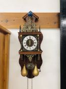 AN ORNATE DUTCH WEIGHT DRIVEN WALL CLOCK