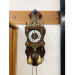 AN ORNATE DUTCH WEIGHT DRIVEN WALL CLOCK