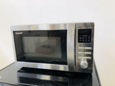 A SHARP STAINLESS STEEL MICROWAVE GRILL PLUS A BREVILLE BREAD MAKER - SOLD AS SEEN