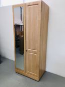 A MODERN TWO DOOR LIMED FINISH WARDROBE WITH MIRROR TO ONE DOOR WIDTH 80CM. HEIGHT 192CM.