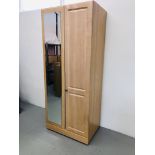 A MODERN TWO DOOR LIMED FINISH WARDROBE WITH MIRROR TO ONE DOOR WIDTH 80CM. HEIGHT 192CM.