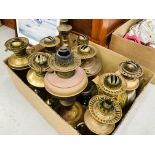 BOX OF VINTAGE DECORATIVE COPPER & BRASS OIL LAMPS SOME WITH COLOURED FONTS